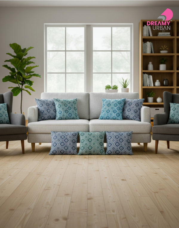 Emerald Green, Shade of Grey, Olive cushion covers styled on modern sofa in living room with bookshelf backdrop